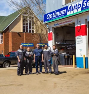Optimum Auto Service team outside the Edmonton auto repair shop